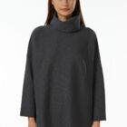 High-neck poncho in 100% Extrafine Merino, fabric stitch,