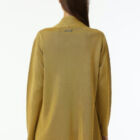 Milano stitch caban in 100% shiny viscose, long sleeves, pockets at front, sligtly A line and asimmetrical edgings.