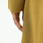 Milano stitch caban in 100% shiny viscose, long sleeves, pockets at front, sligtly A line and asimmetrical edgings.