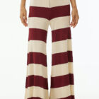 Shiny viscose striped large vestibility pants with elastic band at waist, wide at bottom.