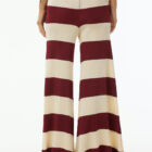 Shiny viscose striped large vestibility pants with elastic band at waist, wide at bottom.