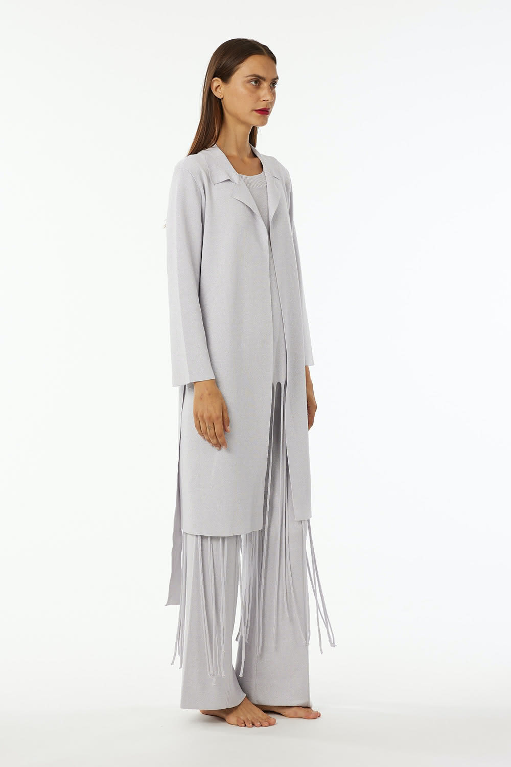 Lurex trench double knit with reverse neck and belt.