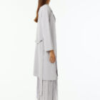 Lurex trench double knit with reverse neck and belt.