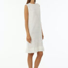 Crew neck sleeveless dress with flat rib, length at knee and cotton fringes at bottom.