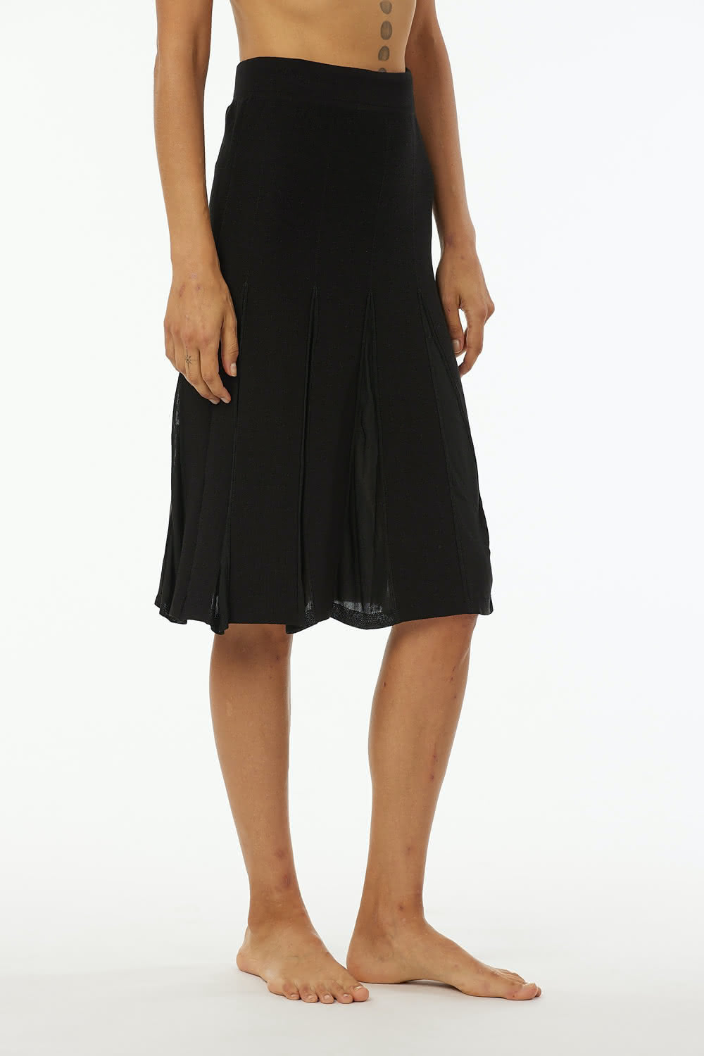 Midi skirt in mix cotton with pleats in viscose, slightly A line, elastic band at waist. Length at knee.