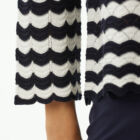 Boxy vestibility crew neck sweater in striped lace stitching with 7/8 sleeve.