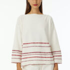 Boat neck oversized pull in 100% cotton stripes at bottom in various colors a line 7/8 sleeve wide vestibility.