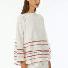 Boat neck oversized pull in 100% cotton stripes at bottom in various colors a line 7/8 sleeve wide vestibility.