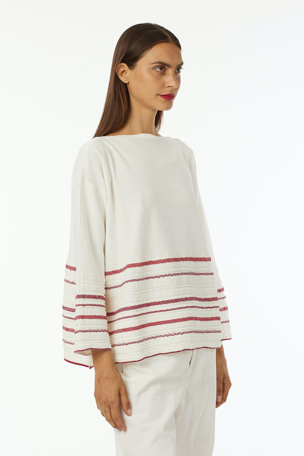 Boat neck oversized pull in 100% cotton stripes at bottom in various colors a line 7/8 sleeve wide vestibility.