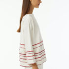 Boat neck oversized pull in 100% cotton stripes at bottom in various colors a line 7/8 sleeve wide vestibility.