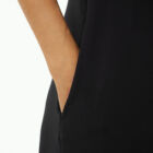 Shoulderless jumpsuit in stretch viscose jersey tight at chest and wider underneath large leg with pockets.